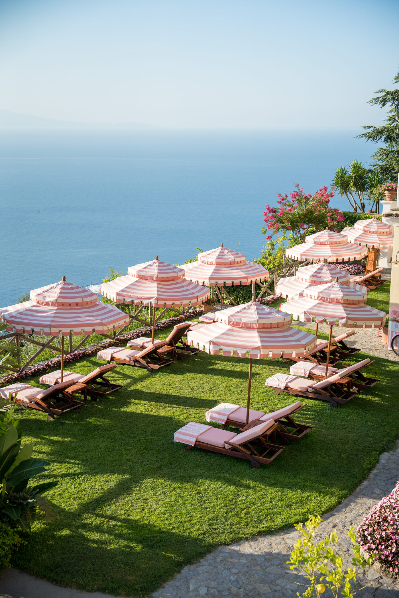 Pink-striped parasols on the lawn of Palazzo Avino, high above the Tyrrhenian sea