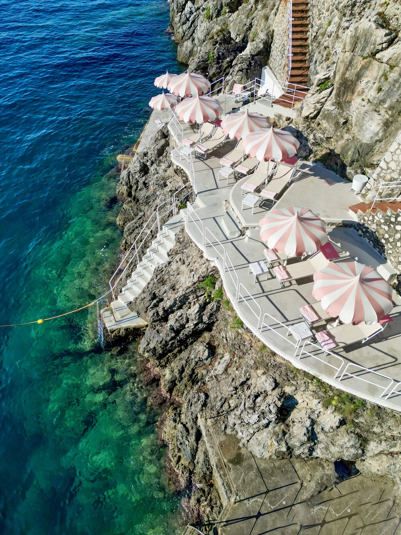 Aerial view of the Clubhouse by the Sea, Palazzo Avino's beach club carved into the cliff