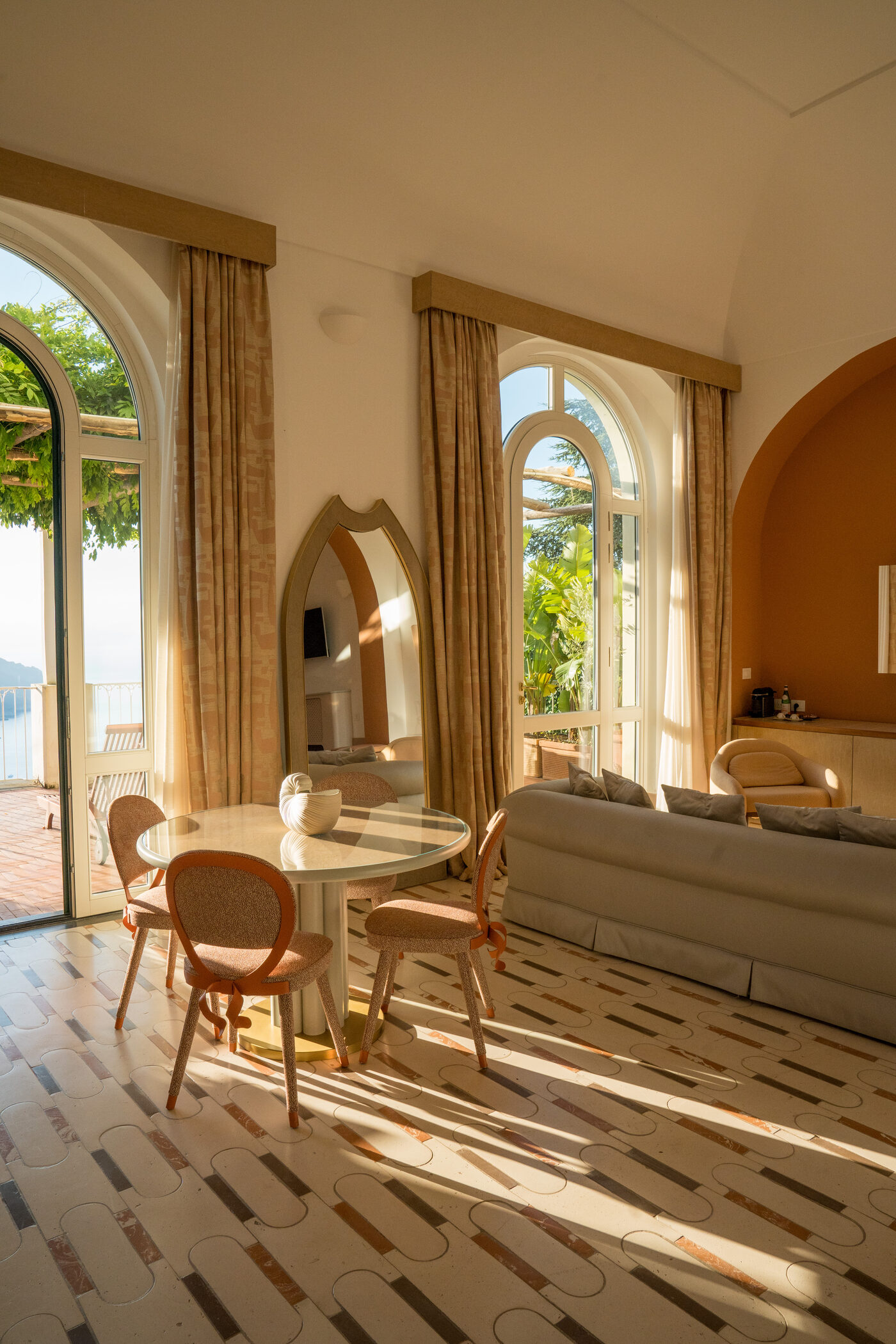 A suite at Palazzo Avino, afternoon light through moorish arched windows