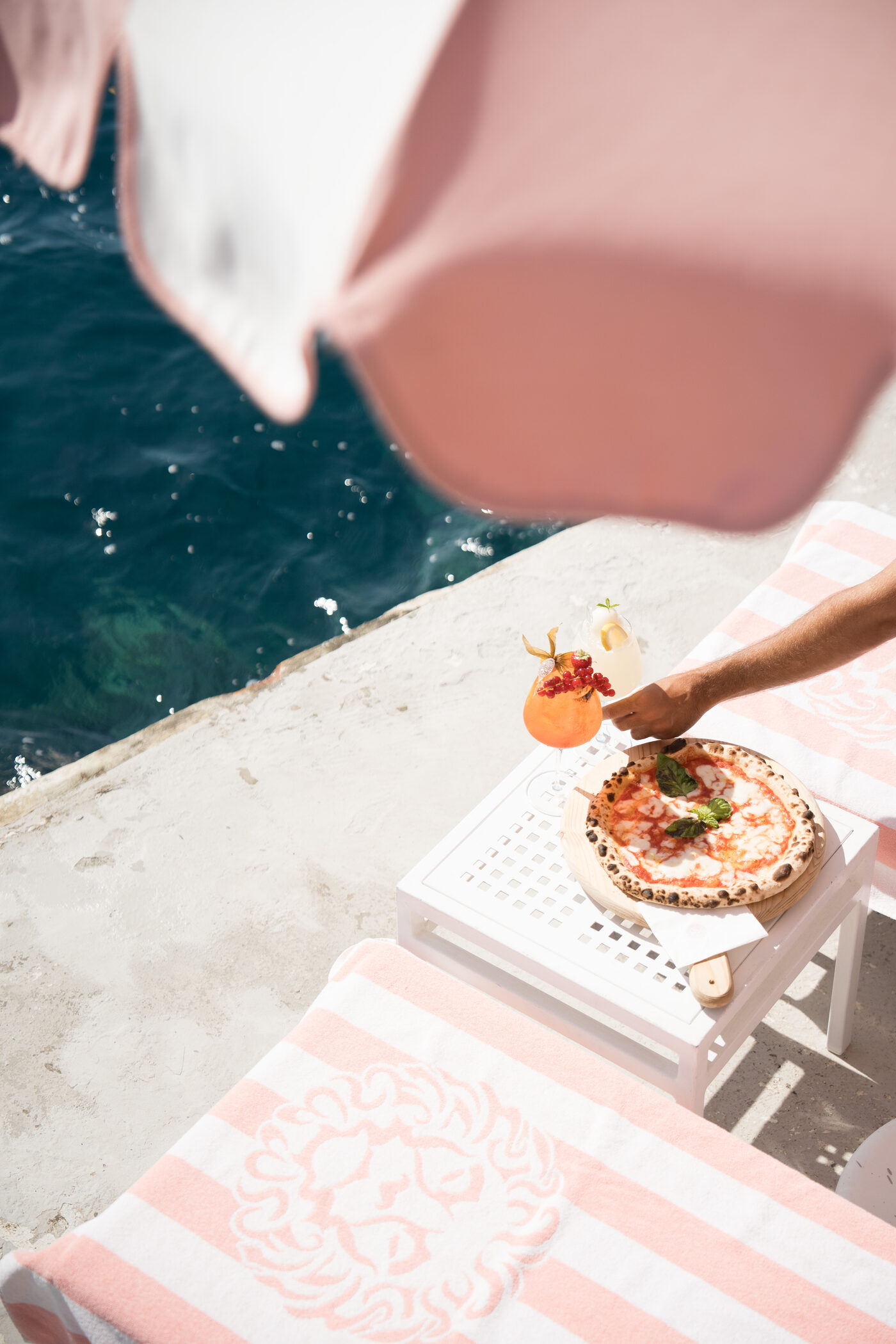 Pizza and spritz served at the water's edge, Clubhouse by the Sea, Palazzo Avino